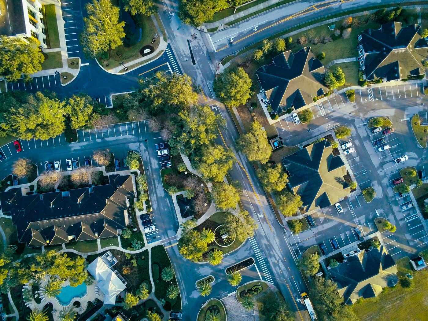 An aerial view of residential streets and greenery