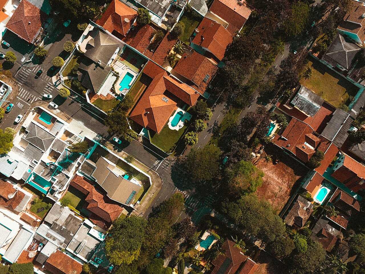 An aerial view of a residential area of houses and streets