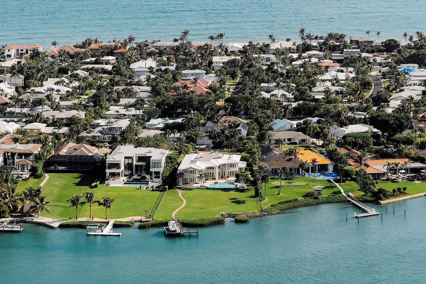 An aerial view of waterfront homes with docks