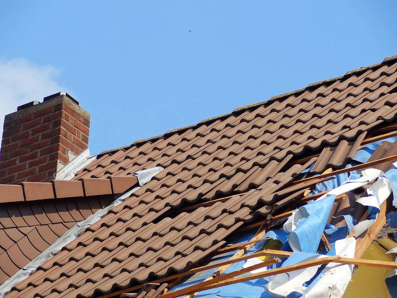 Broken roof tiles and damage after a storm
