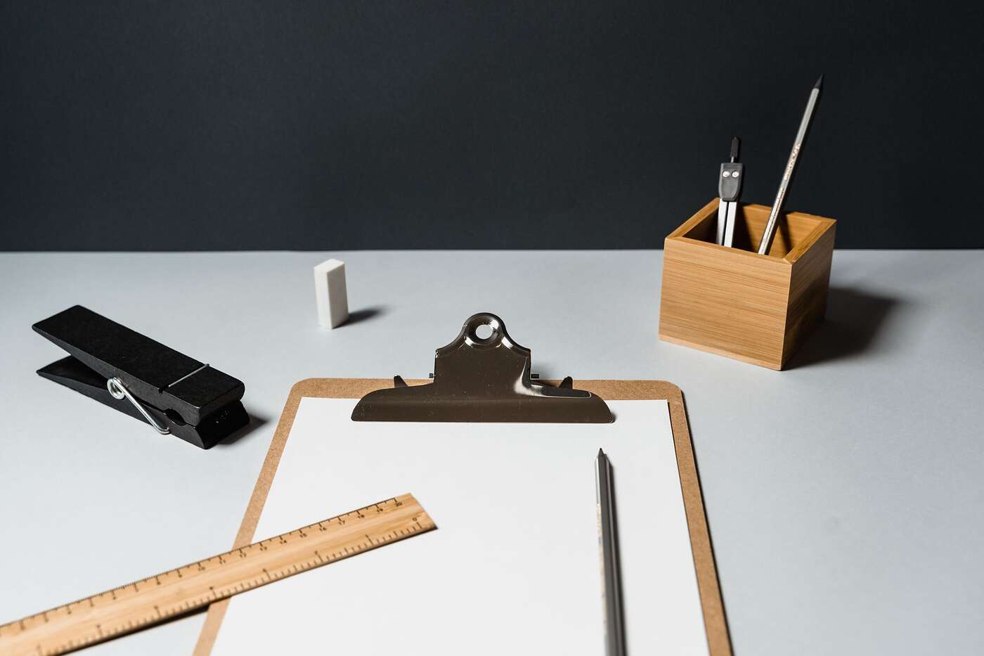 An office desk with a clipboard and pen