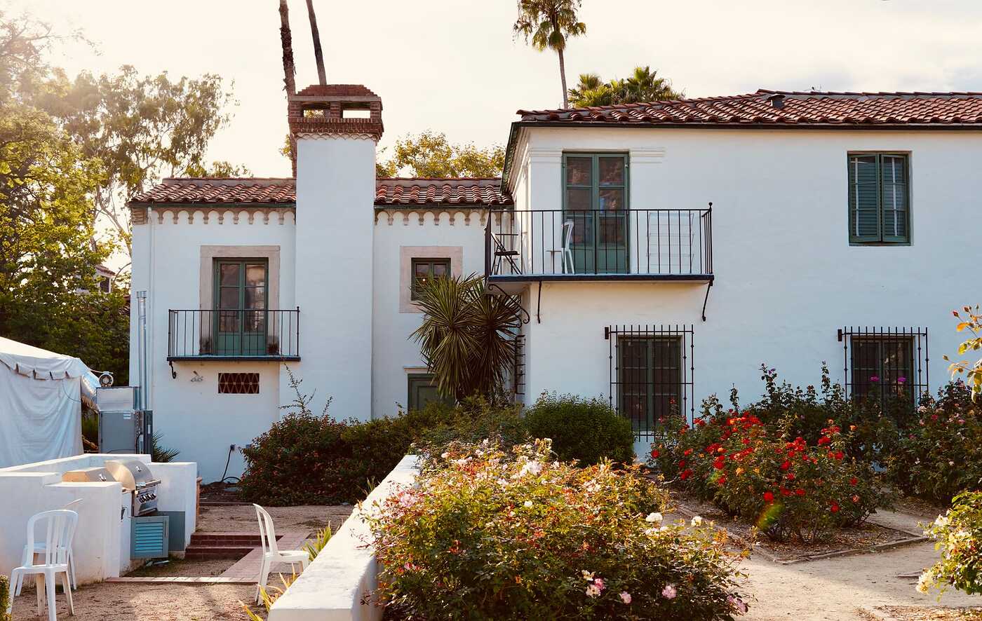 A Spanish Colonial house with a garden